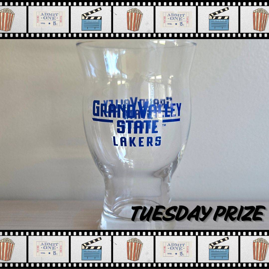 Clear glass cup with "Grand Valley State University Lakers" printed on the front and back side in blue